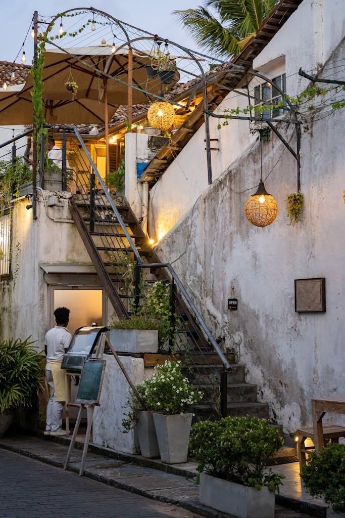 A cozy cafe nestled in the historic Galle Fort, Sri Lanka, capturing rustic charm at twilight.