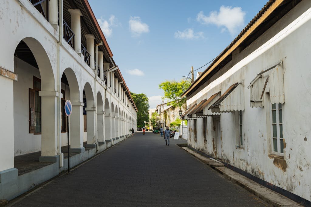 Charming view of a historic street in Galle Fort, Sri Lanka, showcasing colonial architecture and a serene urban environment.