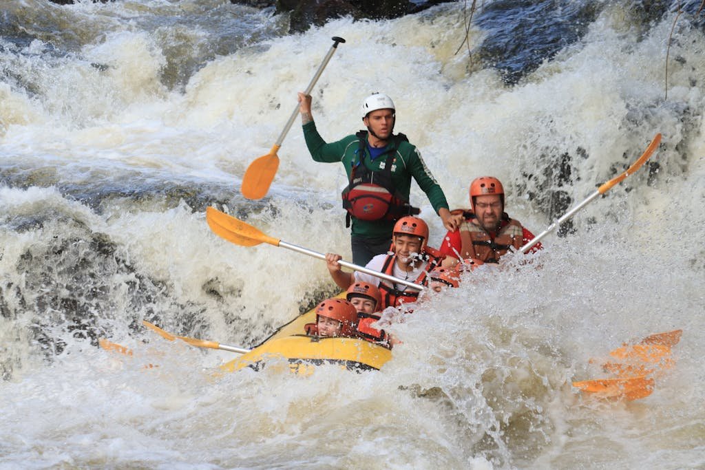 Thrilling whitewater rafting experience in Brotas, Brazil, with a group navigating rapids.Thrilling White Water Rafting Adventure in Kitulgala!